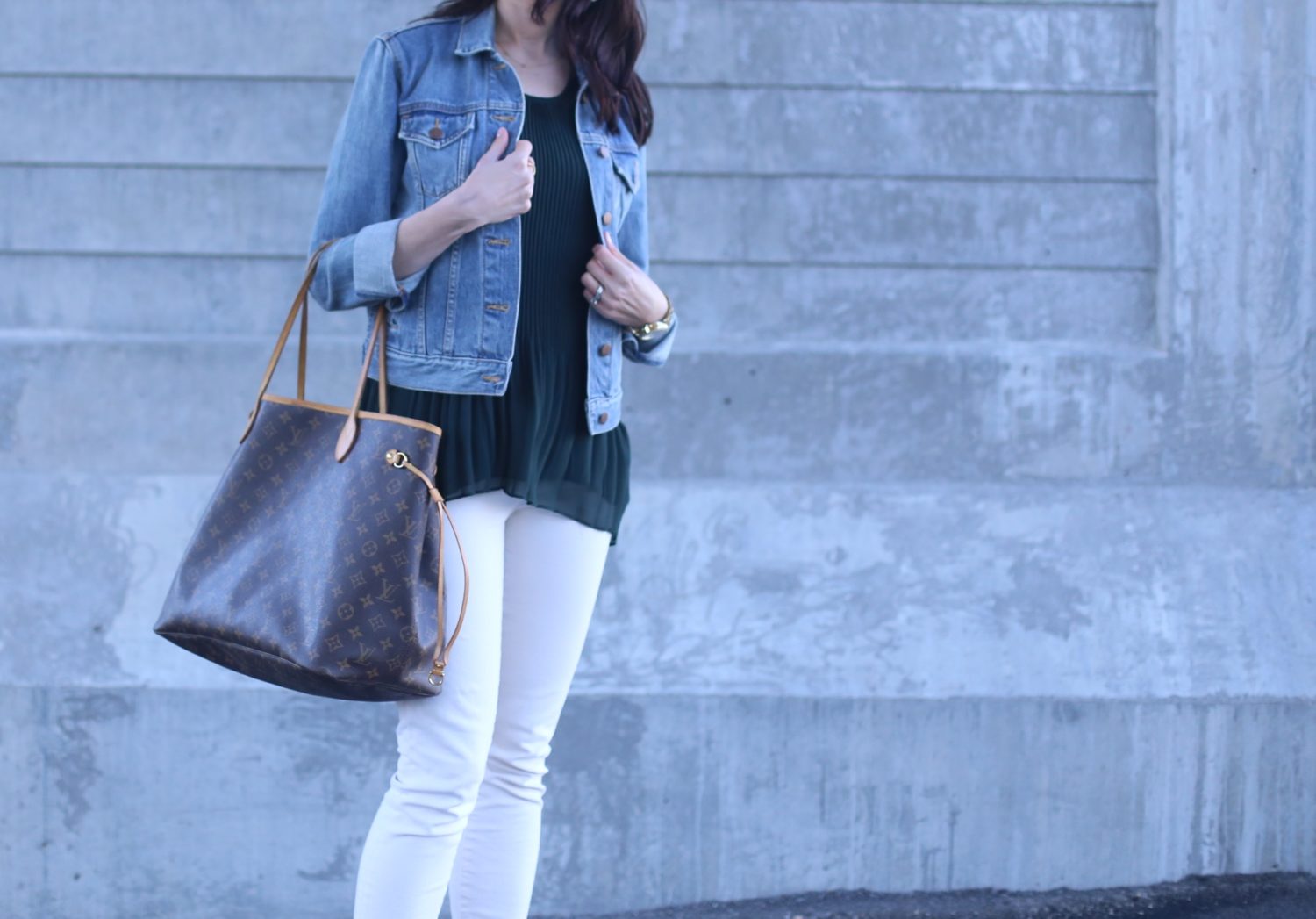 Louis Vuitton bag, skinny jeans in ecru, peplum top