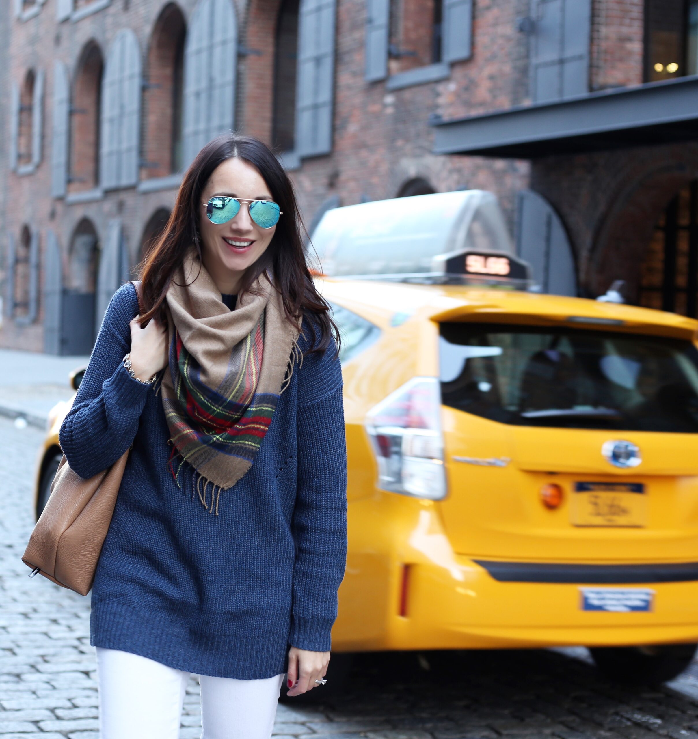 blogger Anna Monteiro of Blushing Rose Style wearing mock neck sweater, BP. plaid scarf and white J.Crew toothpick denim 