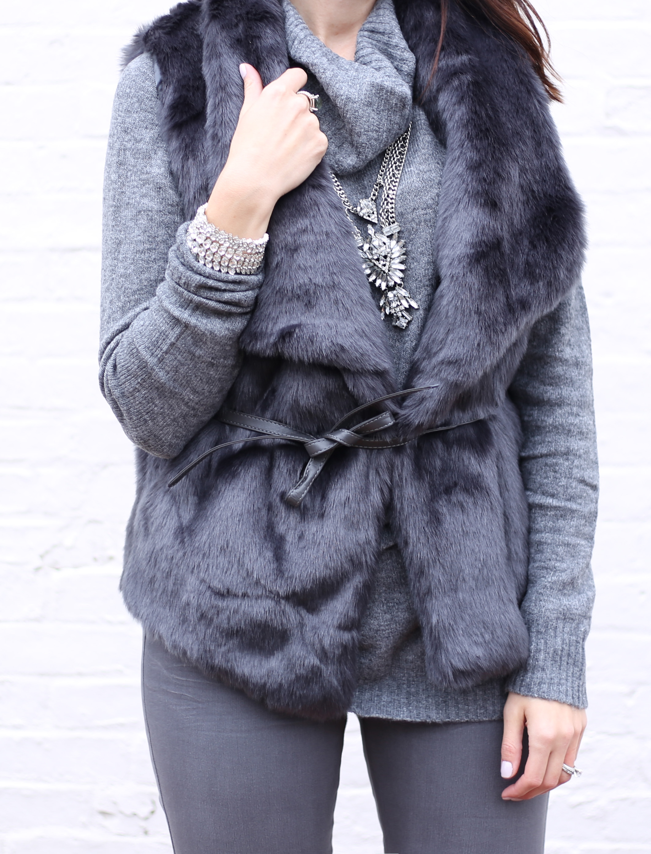 blogger Anna Monteiro of Blushing ROse Style wearing LOFT faur fur vest and Mrac Fisher over the knee alinda boots in grey