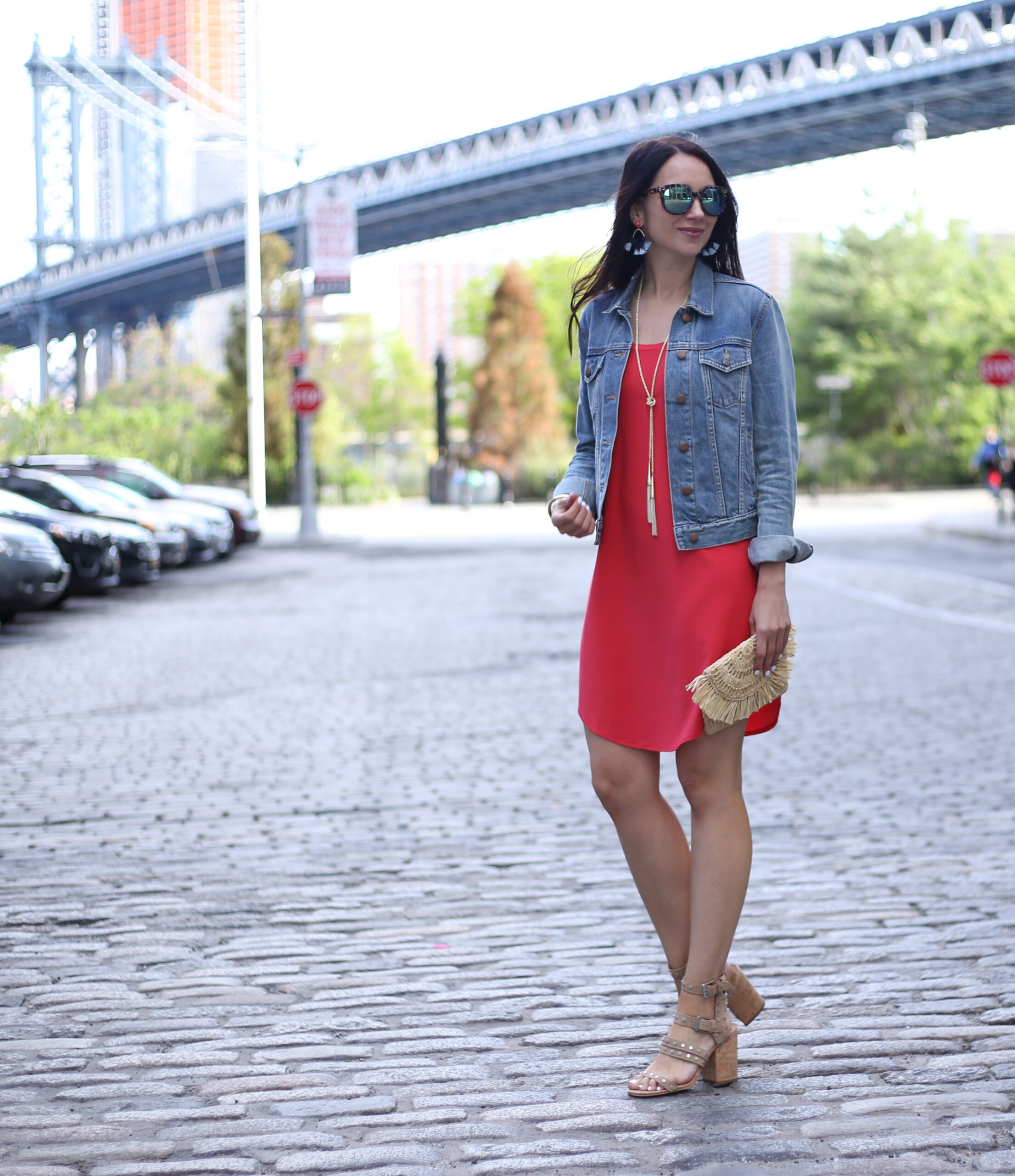 Anna Monteiro of Blushing Rose Style wearing Madewell denim jacket and red Leith tank dress