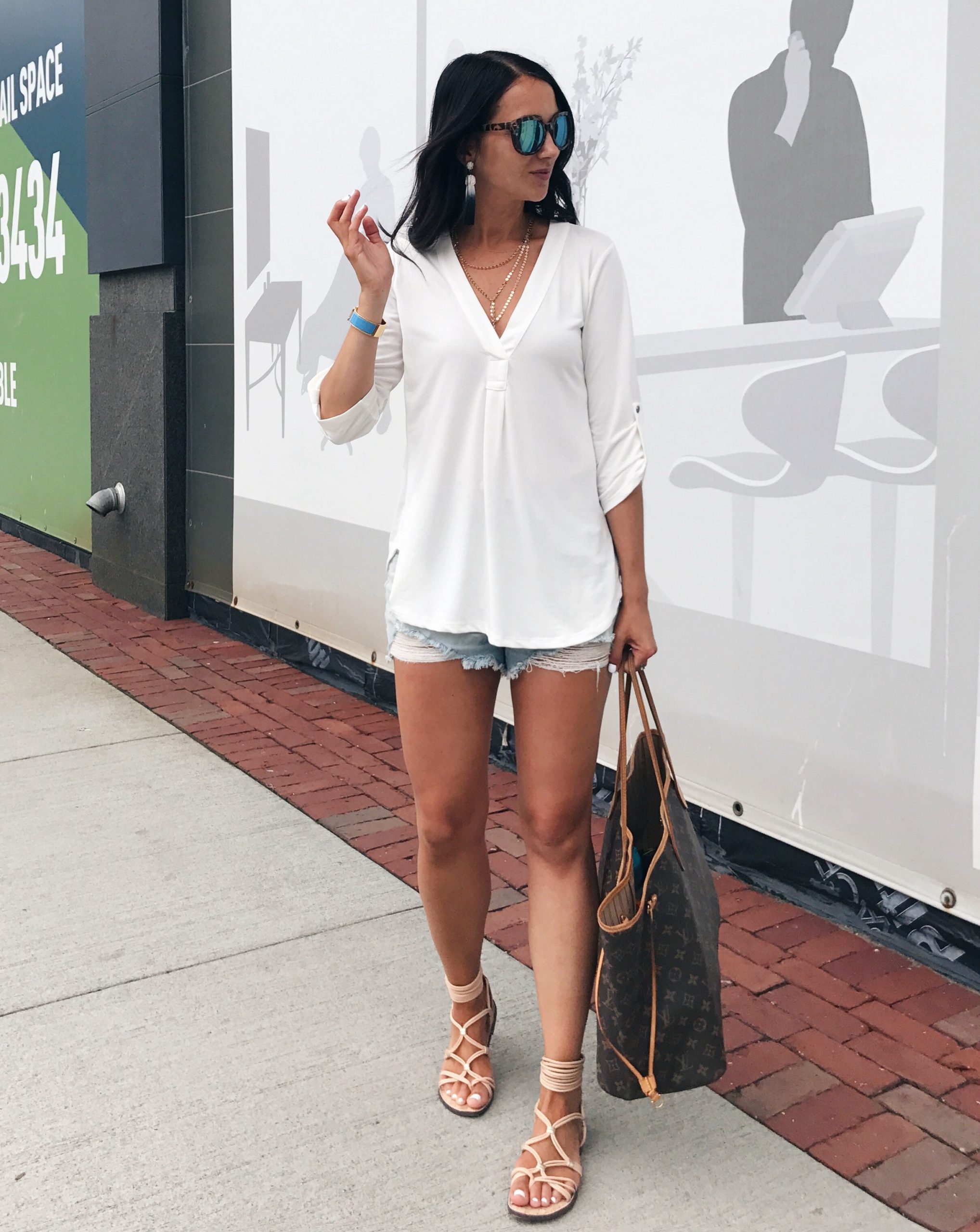 Anna Monteiro of blushing rose style blog wearing denim shorts and henley from Nordstrom Anniversary sale