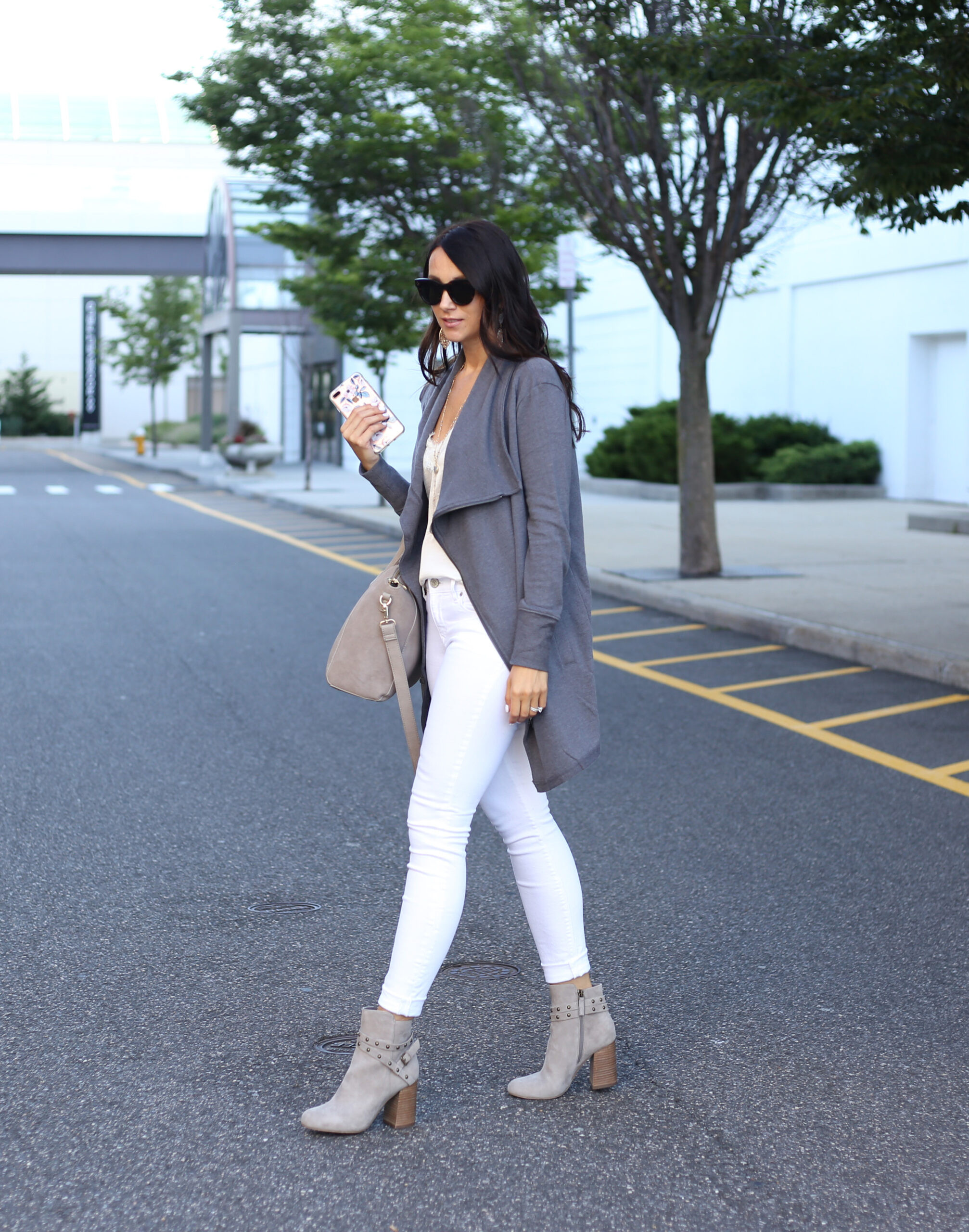 blogger Anna Monteiro of Blushing Rose STyle fashion blog wearing grey BP. booties from the Nordstrom Anniversary Sale 2017 and white jeans