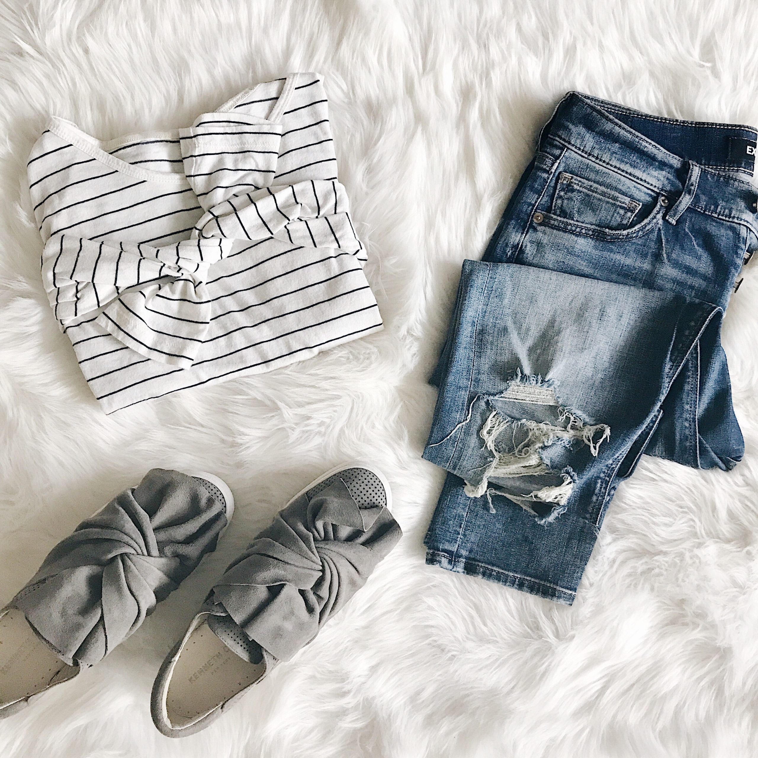 blogger Anna Monteiro of Blushing Rose Style fall outfits flatlay platform bow sneakers, striped tee and jeans