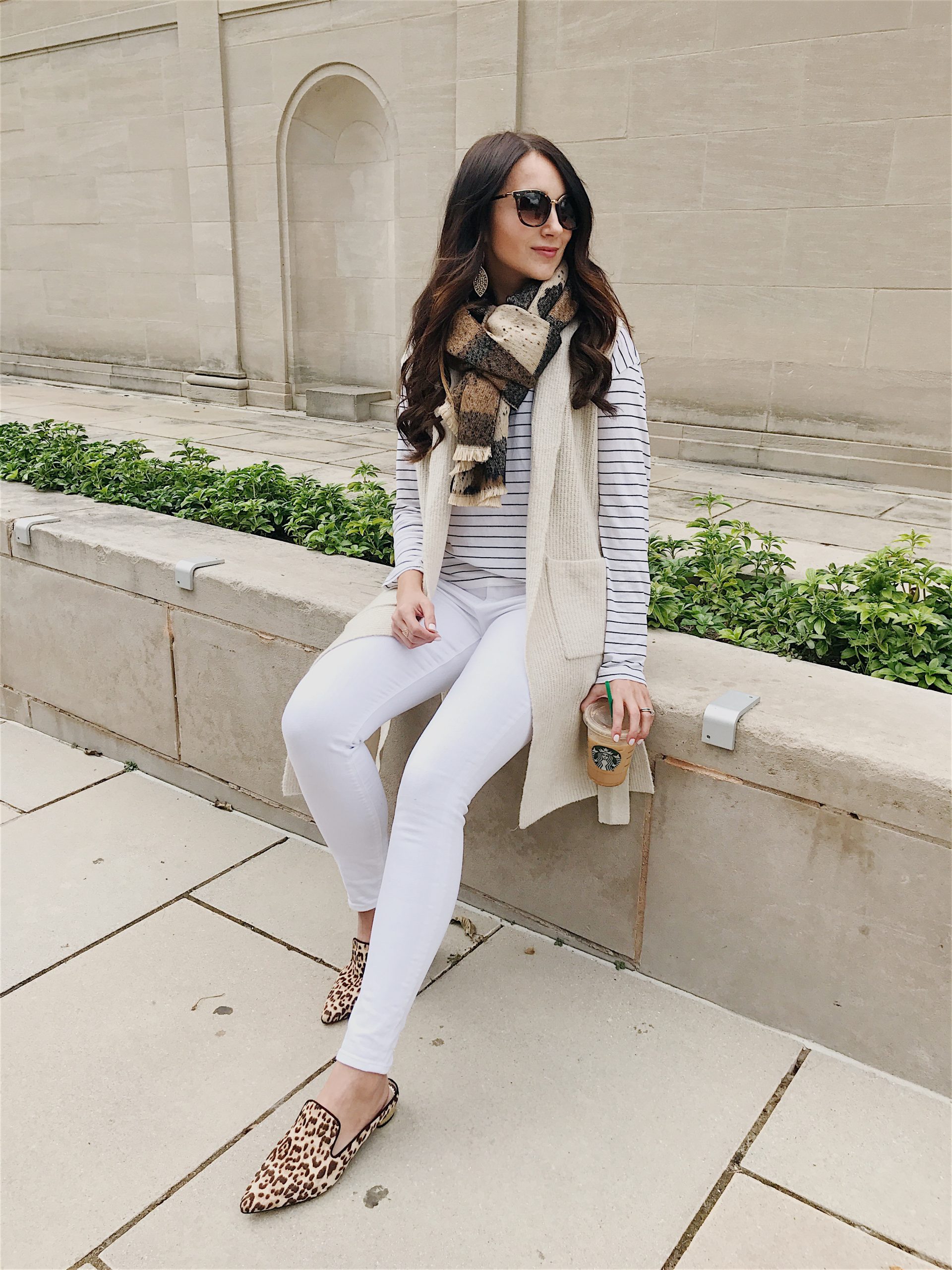 blogger Anna Monteiro of Blushing Rose Style wearing cute fall outfit leopard mules, white cardigan, striped tee and leopard print scarf.