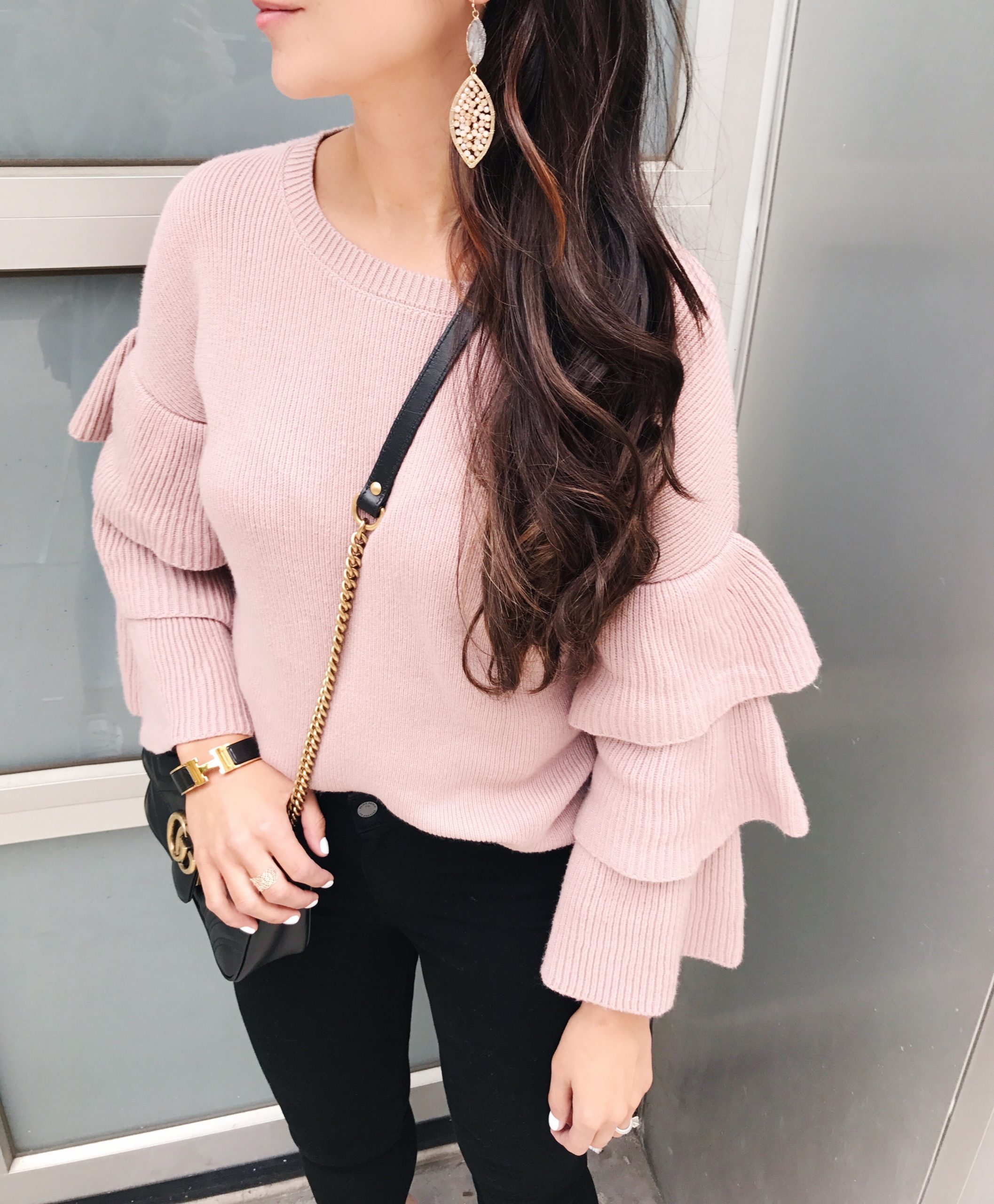 blogger Anna Monteiro of blushing rose style wearing pink halogen sweater with ruffle sleeves and a great pair of jean from nordstrom