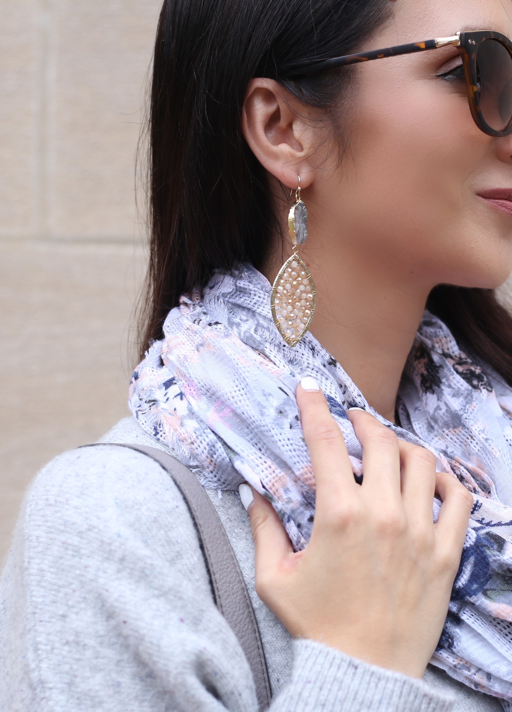 blogger Anna Monteiro of Blushing ROse Style wearing statement earrings in cozy fall sweaters