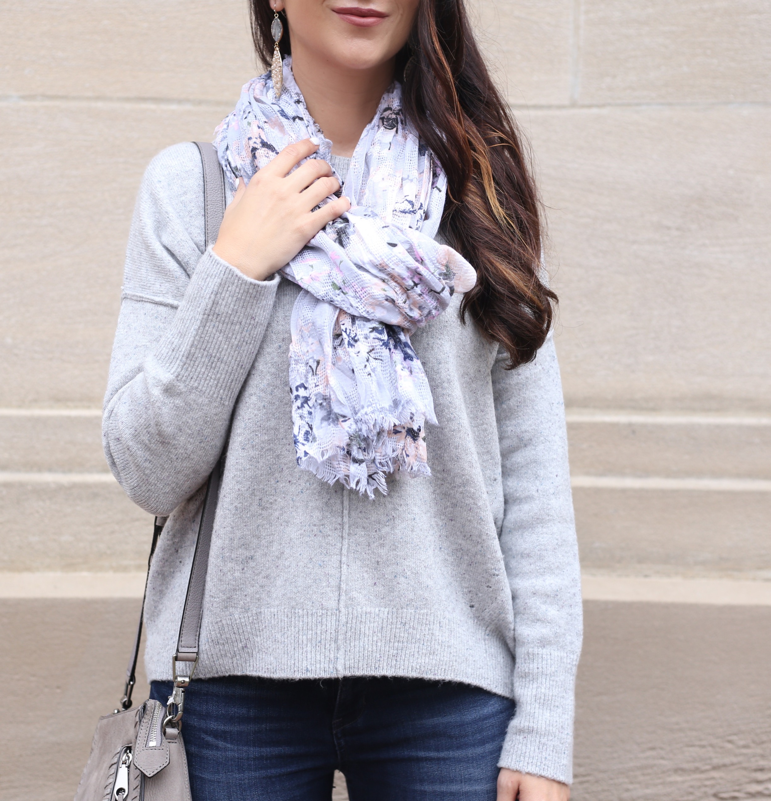 blogger Anna Monteiro wearing cozy fall sweaters and grey slouchy pullover with floral print scarf