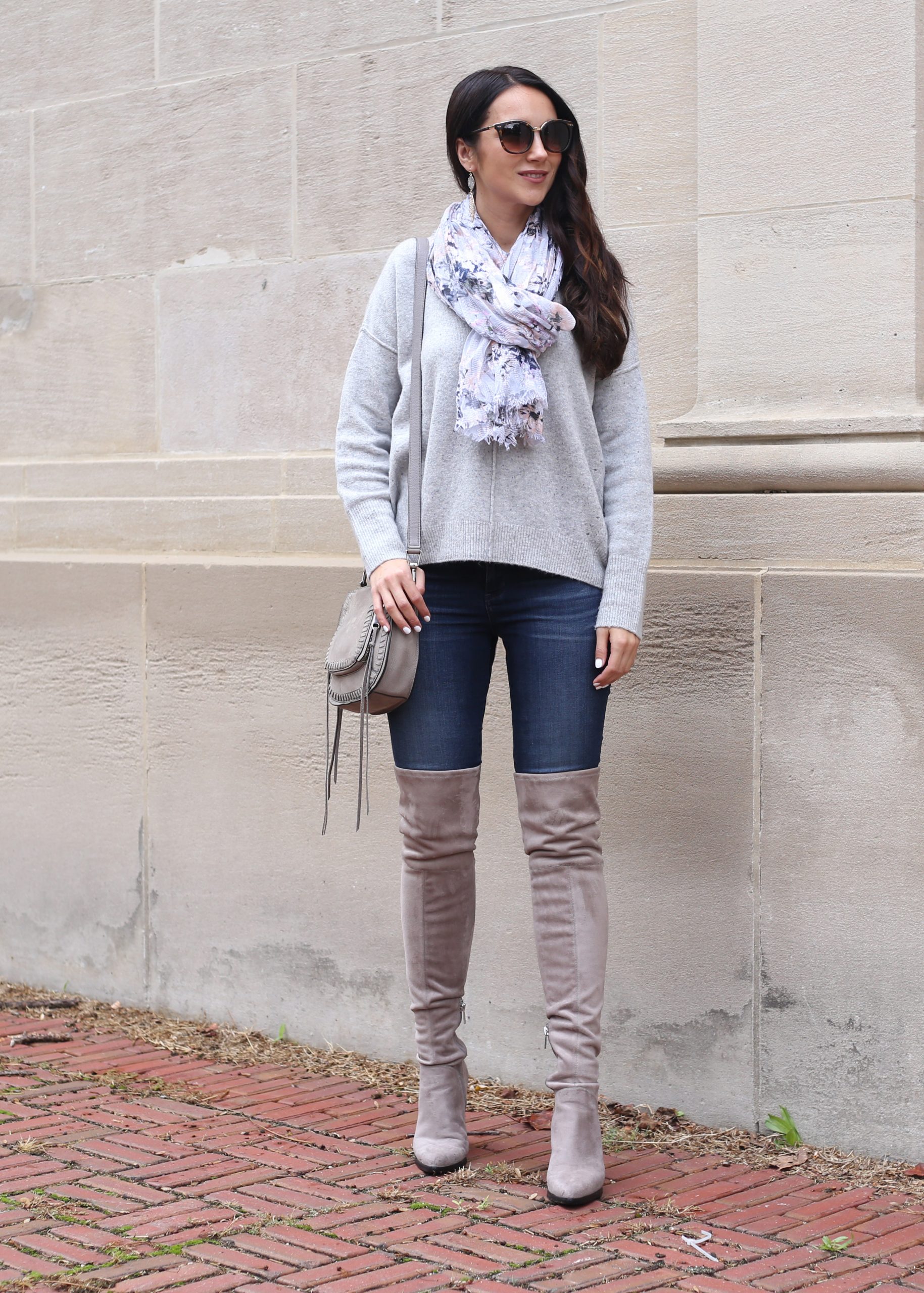 blogger Anna Monteiro of Blushing ROse Style wearing grey over the knee boots and slouchy sweater with skinny jeans in cozy fall sweaters