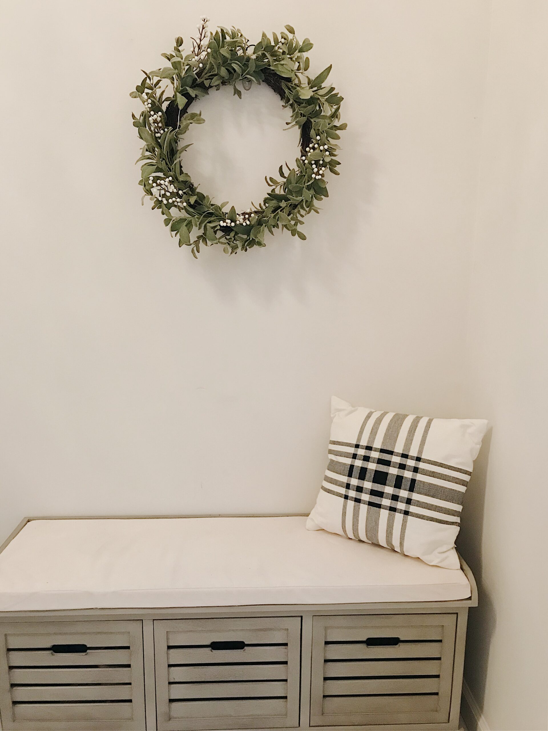 Mudroom bench wreath and plaid pillow