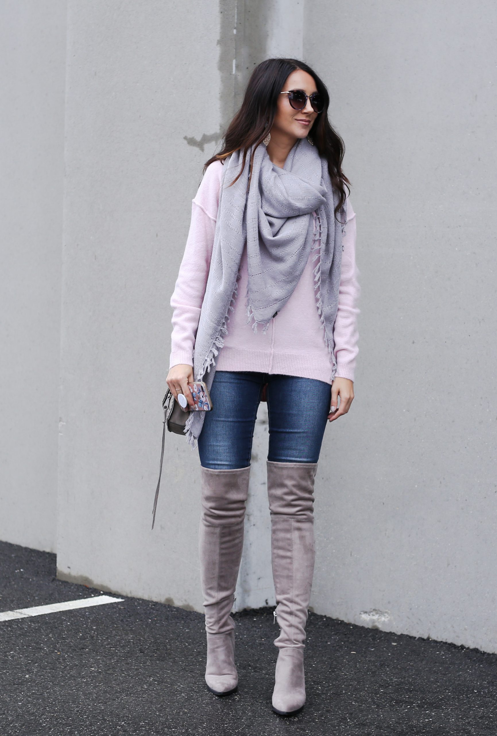 blogger Anna Monteiro wearing over the knee boots in grey blush sweater in casual holiday look