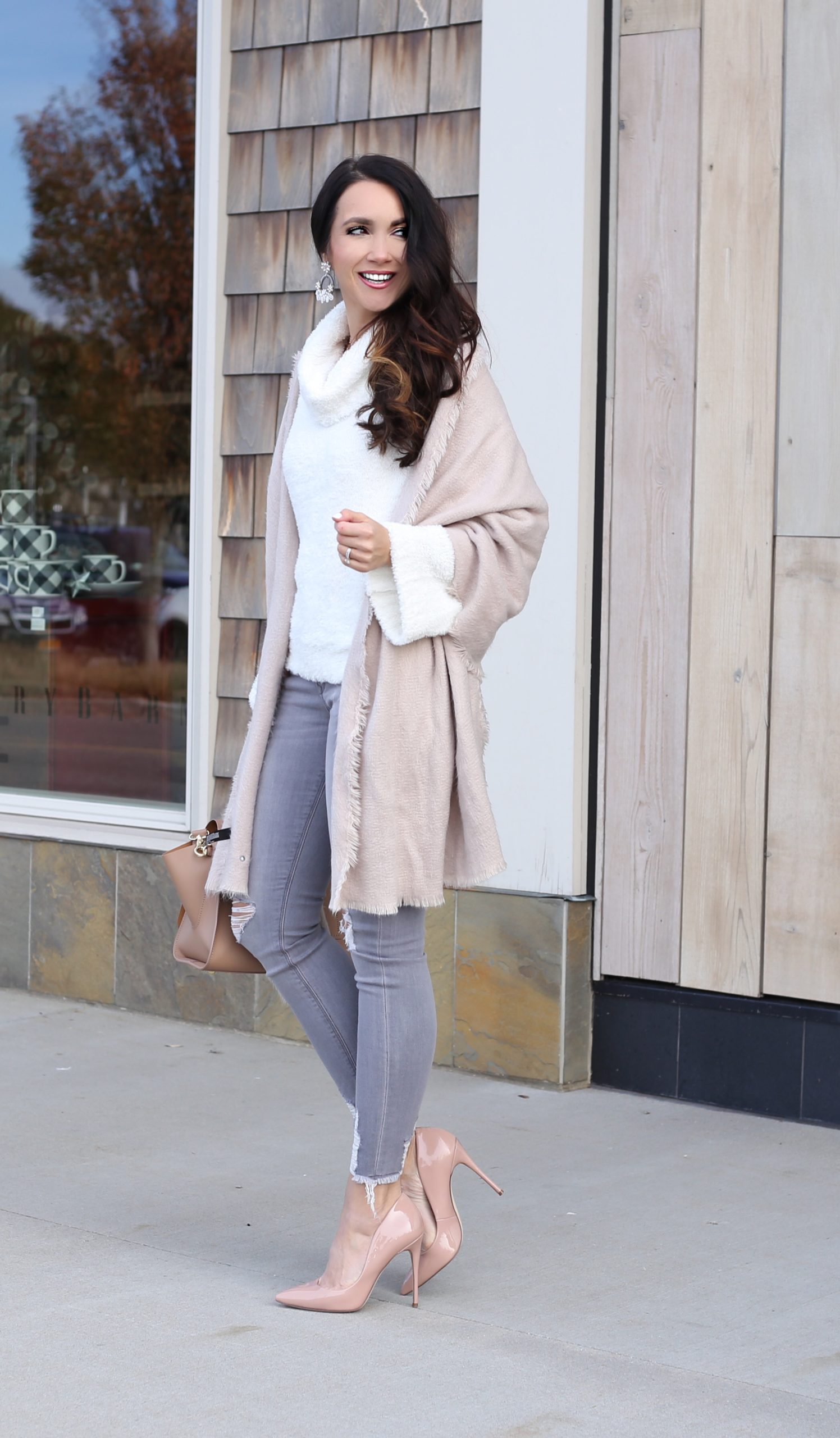 neutral cozy holiday outfit blanket scarf white sweater and nude blush pumps