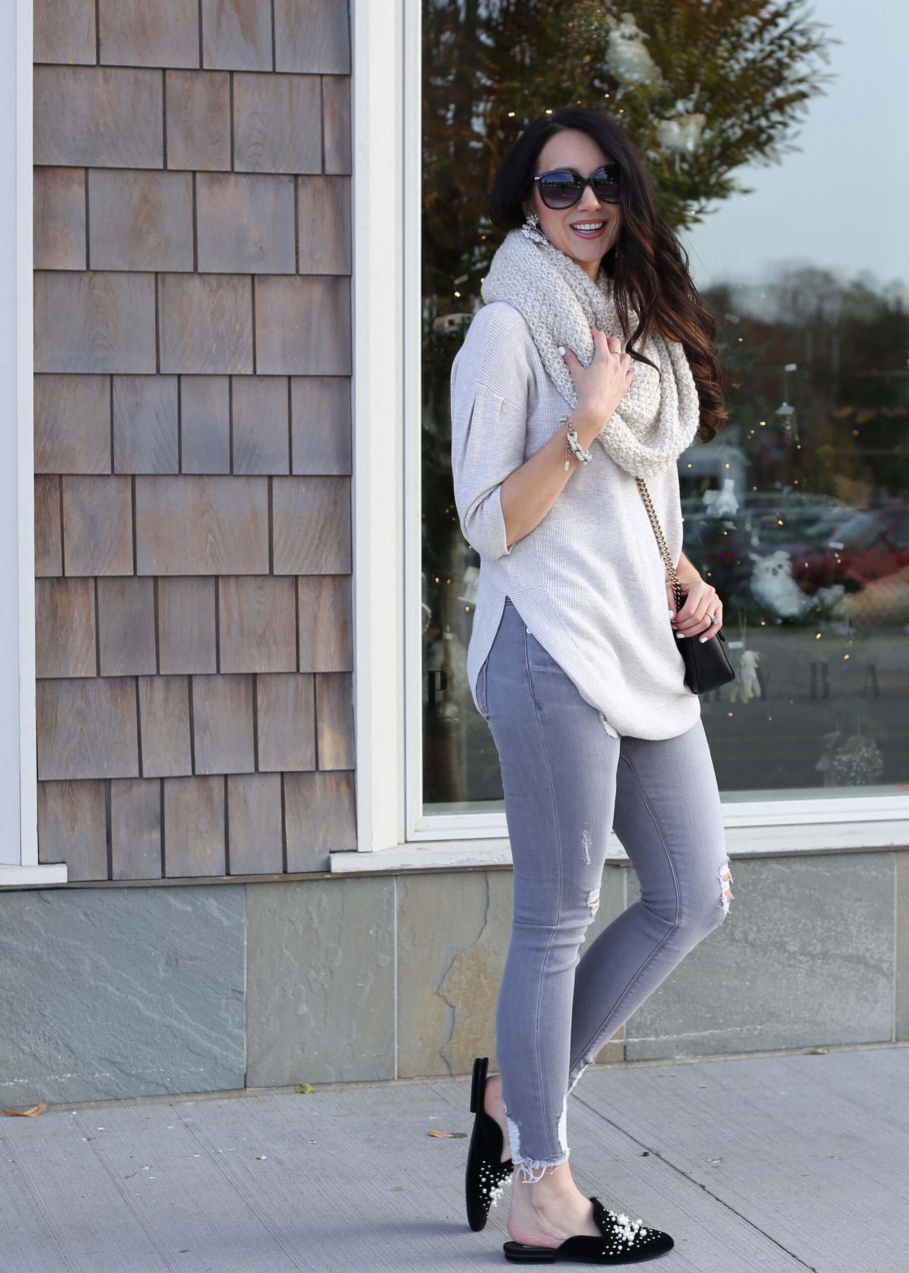 cozy holiday look infinity scarf grey jeans and pearl embellished flats