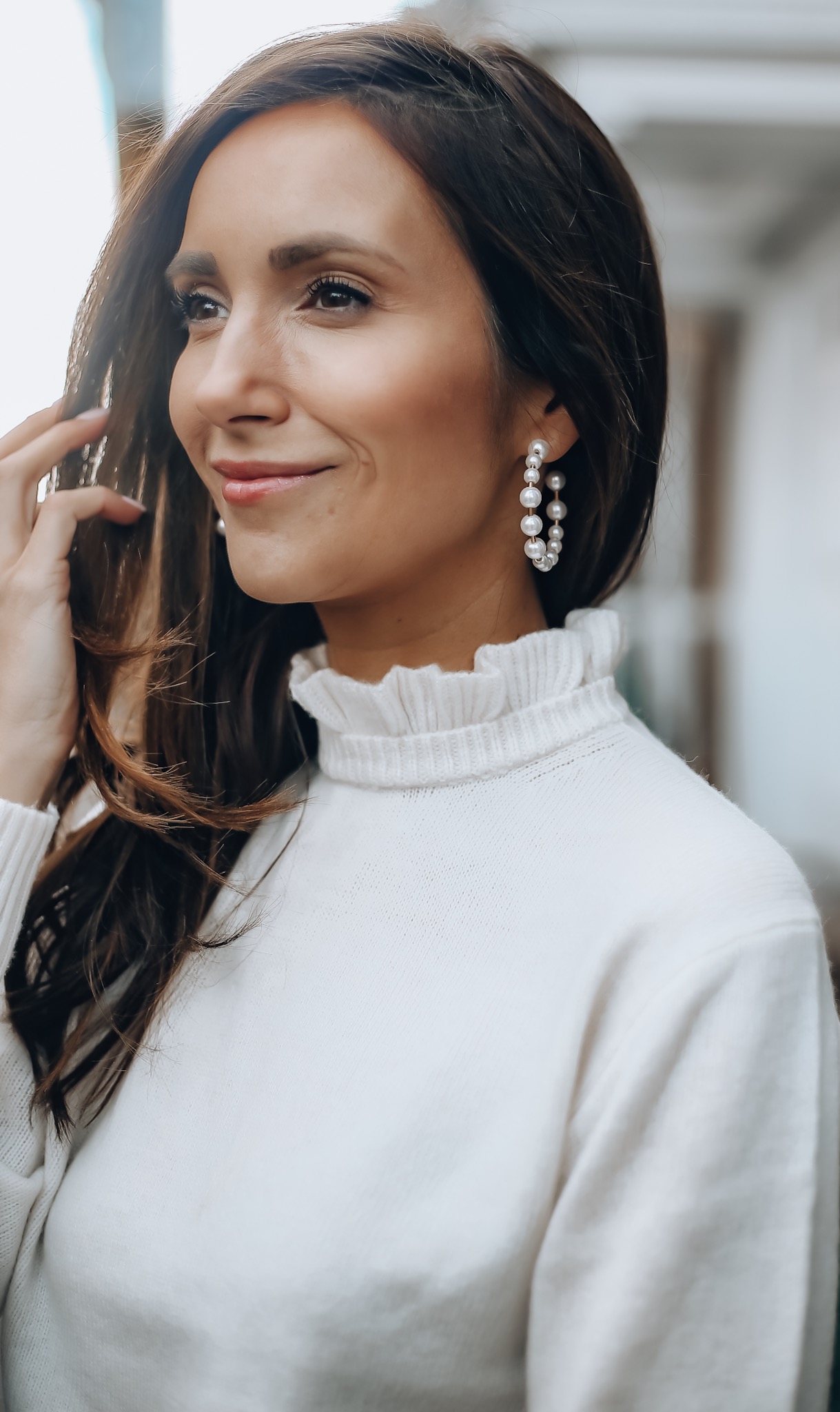 Woman wearing Pearl Hoop Earrings