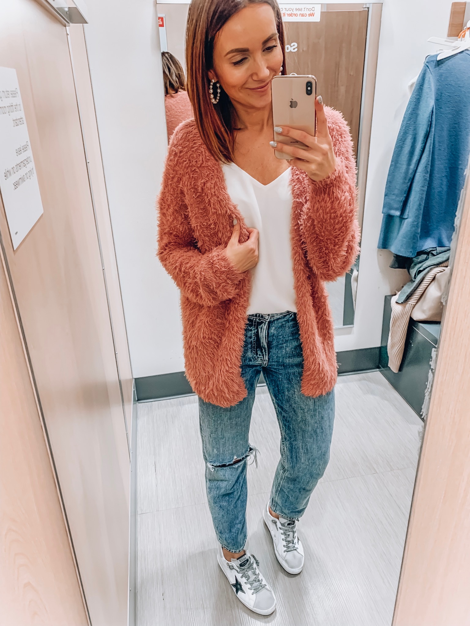 Woman wearing cozy, fuzzy cardigan