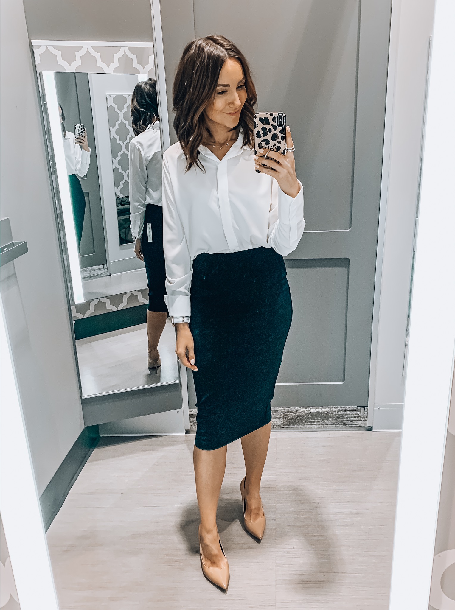 woman wearing workwear style, button down,pencil skirt