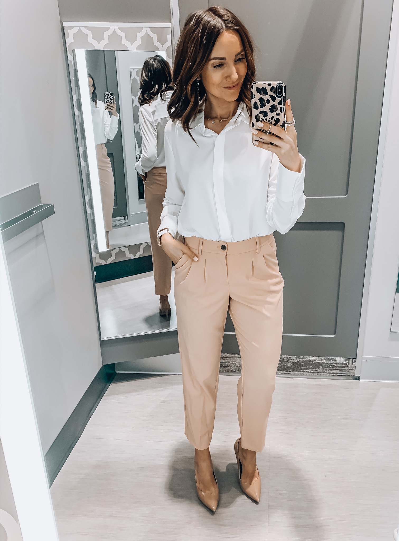 woman wearing white blouse and pink pants, workwear style