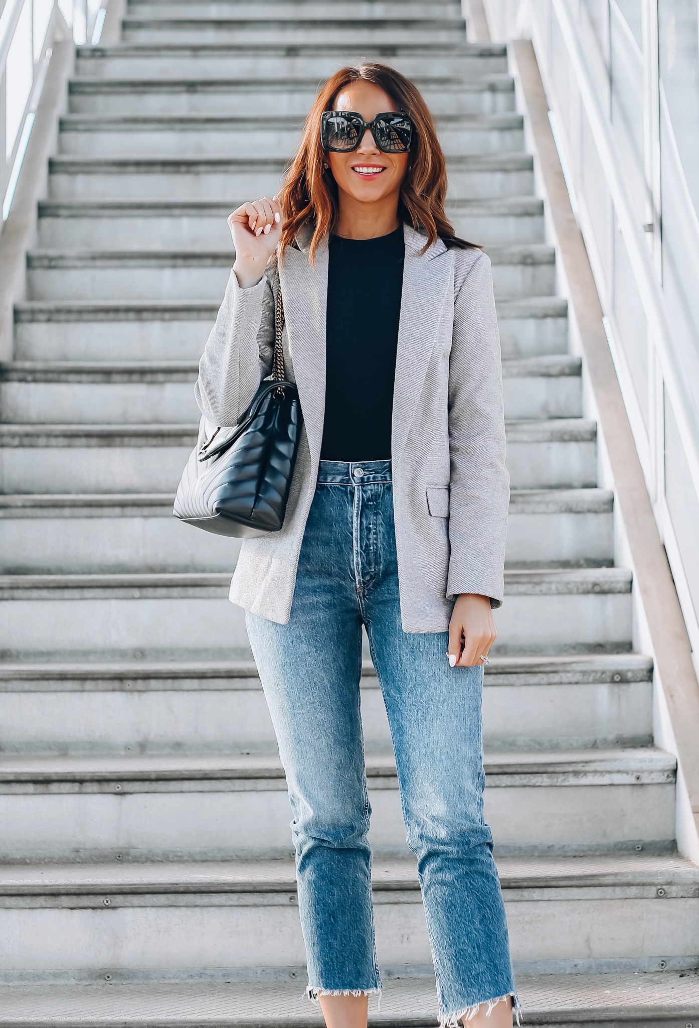 woman wearing blazer, bodysuit, mom jeans