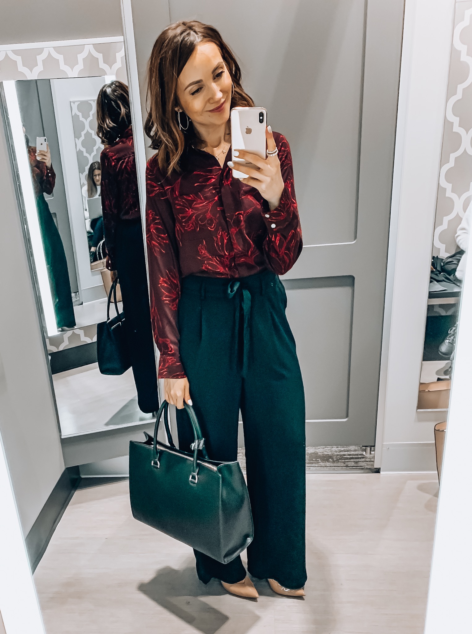 Woman wearing floral blouse and wide leg trousers, workwear, Target style