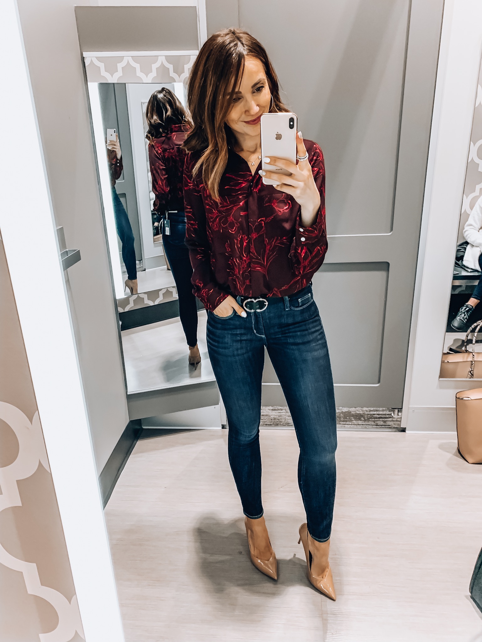 Woman wearing floral blouse and jeans, Target style