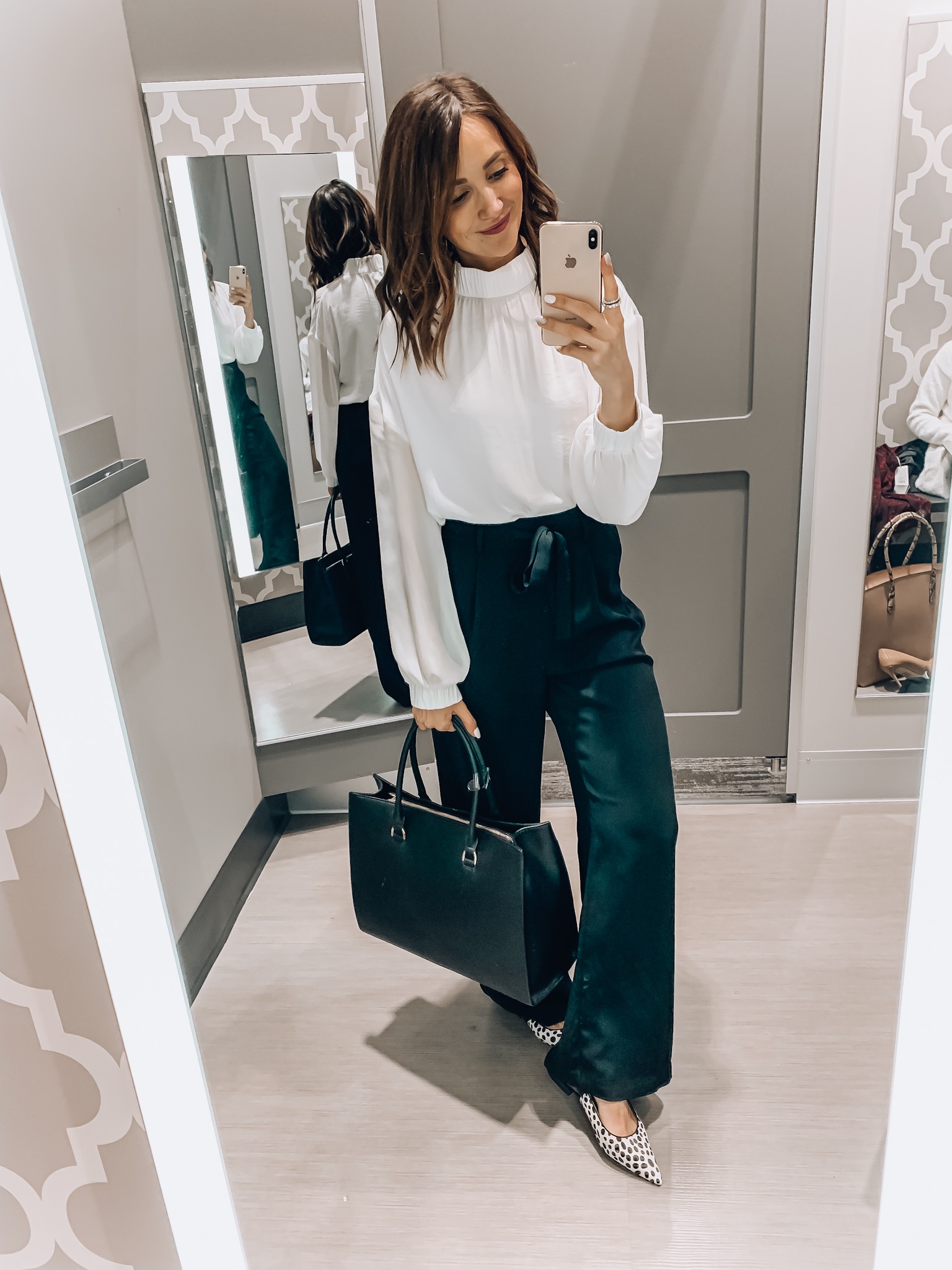 Woman wearing blouse and wide leg pants, workwear style