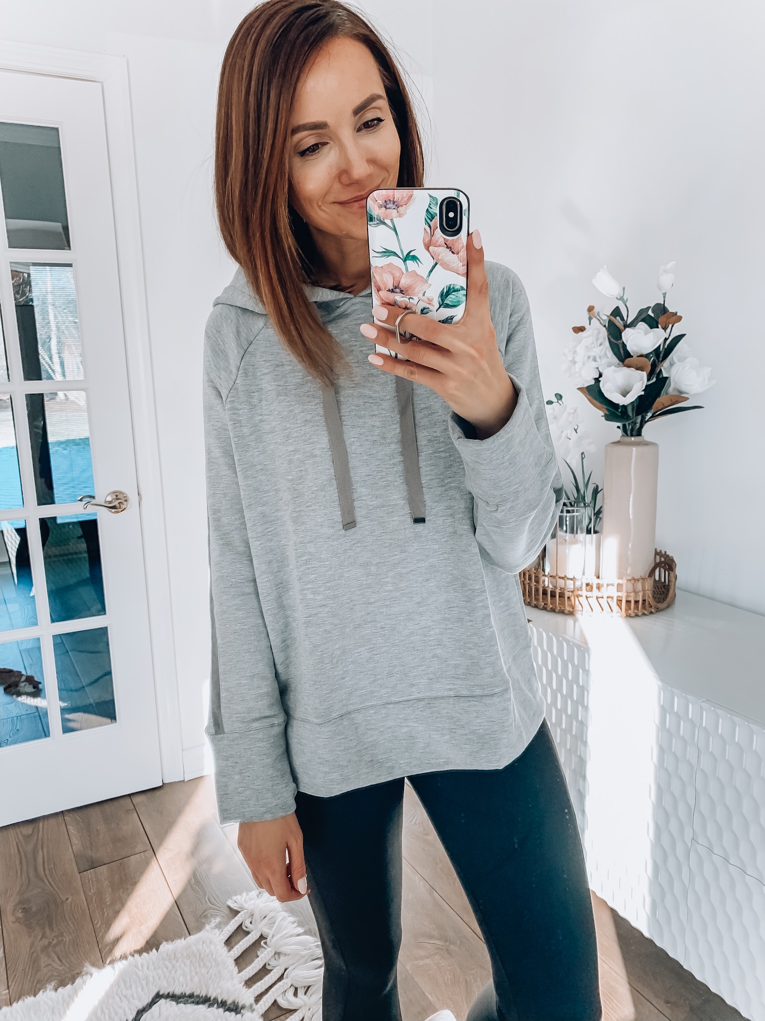 woman wearing hoodie and leggings, athleisure style