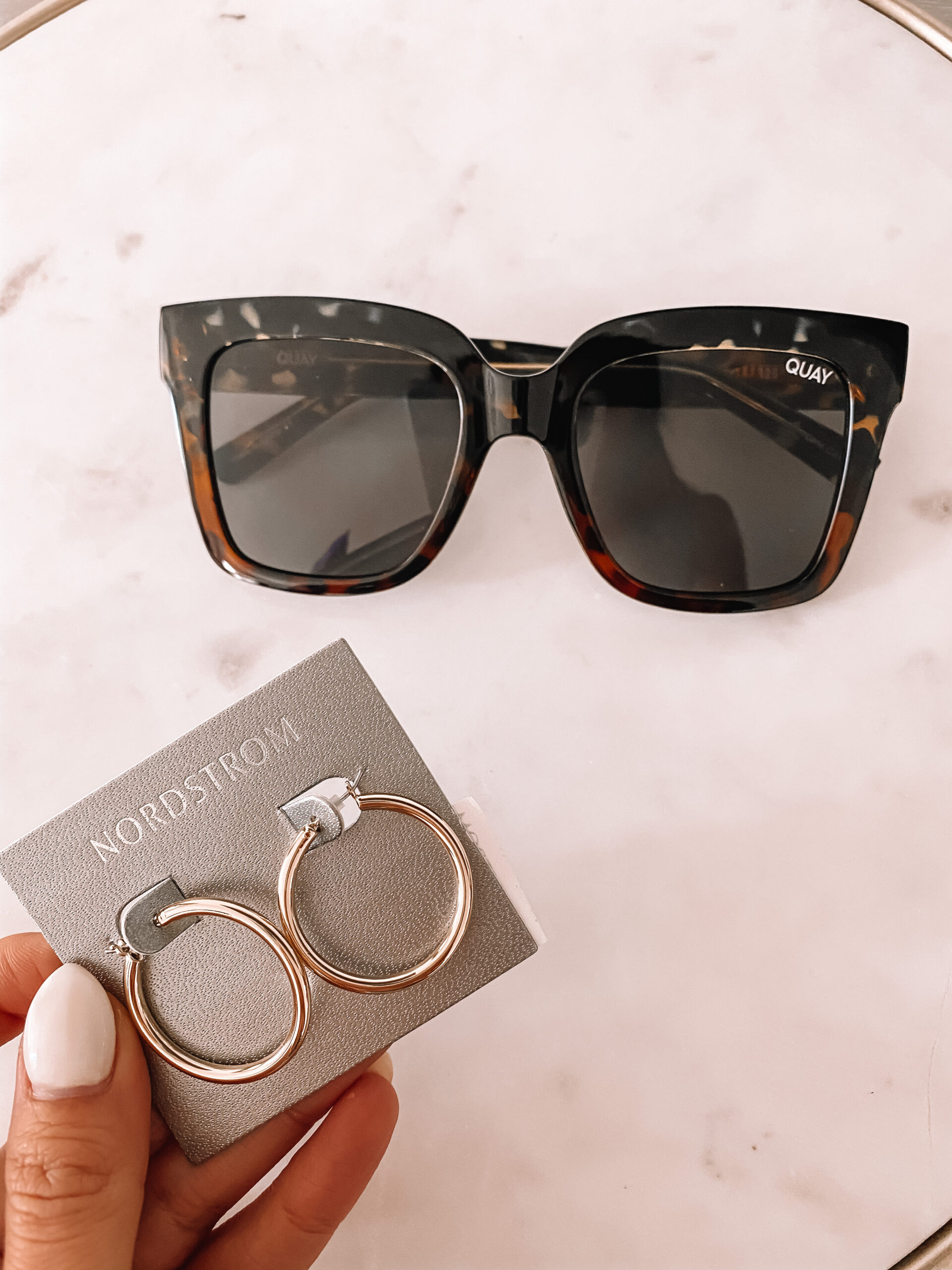 quay sunglasses and gold hoop earrings