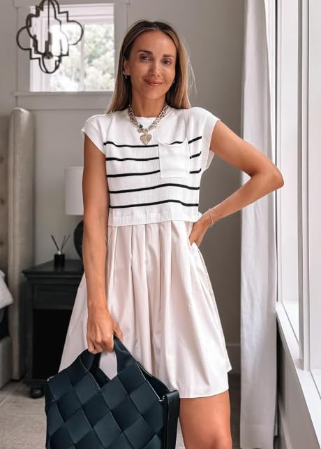 Women’s chic workwear outfit featuring a black and white striped knit top with pocket detail, paired with a pleated white skirt and woven tote bag.